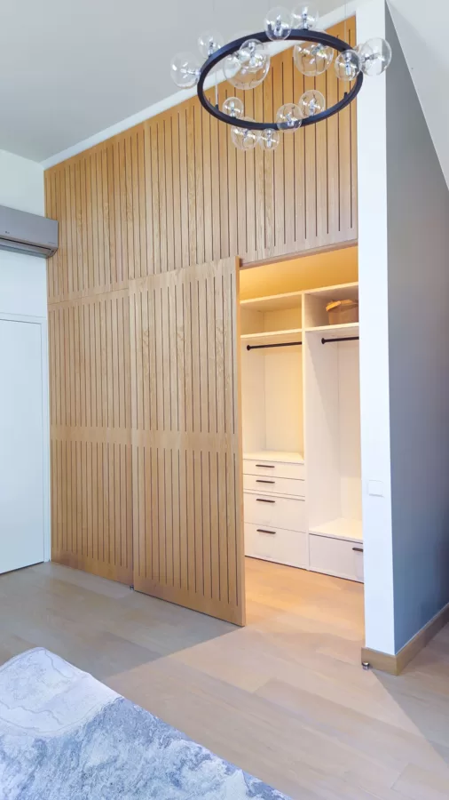 Milled ash panel partition with sliding doors